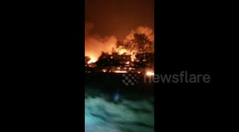 House engulfed by flames as California wildfires spread during heatwave