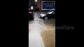 UK: Heavy Rain Causes Street Flooding And Tube Station Closure In West London