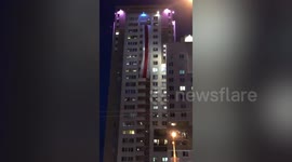 Residents fly red and white protest flag In Minsk, Belarus