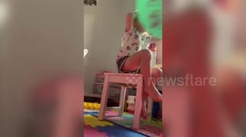 Hilariously cute moment toddler knocked off seat after parent launches ball