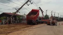 Lorry driver crashes into electricity posts after leaving vehicle's container raised