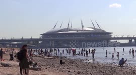 People flow to the city's beach as hot weather arrived to St. Petersburg, Russia