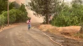 Ranchers fighting fire flee rushing fire in Napa hills