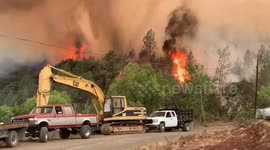 Wildfire in Napa hills behind Napa ranch equipment in California firestorm