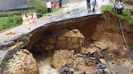 Flooding in Vietnam triggers landslides which leave roads damaged