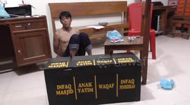 Man thrown into fish pond in Indonesia after stealing from charity box