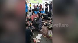 One dead after Chinese tourists fly down glass slide too fast in heavy rain