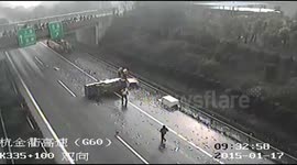Fish delivery truck spills load on motorway in China