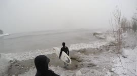 Surfers brave Canadian snow storm