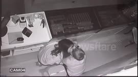 Young lovers steal a kiss while robbing a jewellery store in China