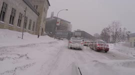 Cars struggle on icy roads during snowstorm in Montreal, Canada