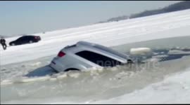 SUV sinks through ice in China