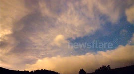 Colorful Clouds In Motion With Stars Behind Time Lapse