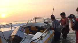 Baby dolphin rescued by locals on beach in Myanmar