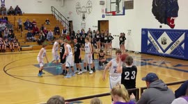 Basketball stuck on rim in final seconds of game (looped)