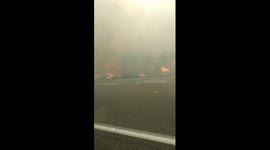 Wildfire burns on either side of highway as residents evacuate Vacaville, California
