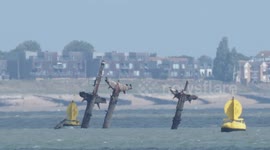 Shipwreck SS Richard Montgomery passed by a ship, yacht & kitesurfer, UK