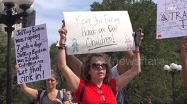 QAnon inspired protesters march through New York calling for action on child abuse