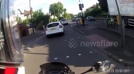 Driver pulls out on biker