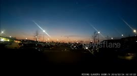 Car drives though parking spaces into oncoming taffic