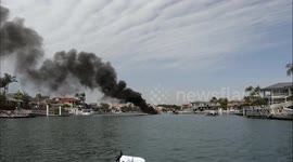 Boat on fire off Runaway Bay, Australia