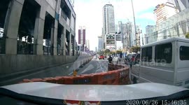 Weird moment plastic barriers blow into road blocking traffic