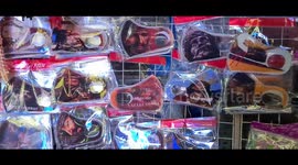 Face masks depicting Jesus sell out outside Philippines church