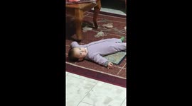 Nice moment child lying on the ground