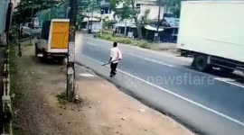 Moment man misses death by whisker after truck zooms past him in southern India