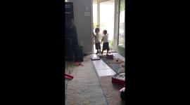 The Hurtt Twins offer mail lady a bottle water.