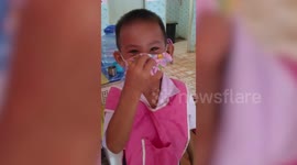 Terrified schoolboy cries while looking for 'lost' face mask which is under his chin