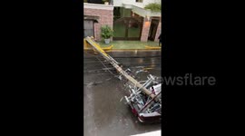 Crash crushed by electric pole as Tropical Storm lashes Dominican Republic