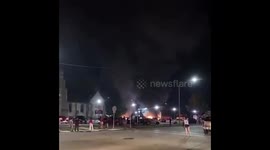 Rioters set fire to car dealership in Kenosha.