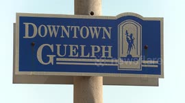 People wearing face masks while shopping in Downtown Guelph Ontario on a nice sunny summer day, part of the new normal during the COVID 19 coronavirus pandemic as people go about their business and shopping again