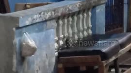 rats trying to jump to get to the food hanging in the plastic