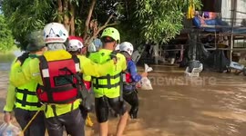 Rescue teams deliver food to stranded residents amid floods in northern Thailand