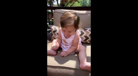 Excitable baby can't stop laughing at the size of her aunt's foot
