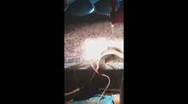 Fishing frenzy! Thousands of fish leap from the deep blue after light illuminates surface off Vietnam coast