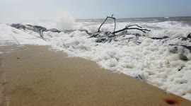 Sea foam on the pier at West Bay Dorset during Storm Francis