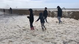 Dorset residents enjoy flying sea foam during Storm Francis