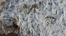 Woman bathing in Kino Beach.