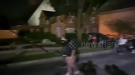 Crowd Stomping on Cars in a Used Car Lot in Kenosha