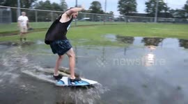 Canada man skimboard after torrential rain Causes flooding
