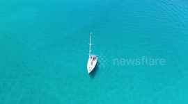 Drone footage of a Sailing Ship in Tropical Waters