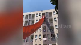Chute set up to help university students move belongings from dorm to ground in China