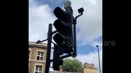 UK: Traffic Light Moving Due To Strong Wind Brought By Storm Francis In London