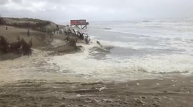 Netherlands: Sea Foam Blankets Beach In Camperduin As Storm Francis Hits