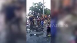 Spectators injured when bridge collapses at drag boat racing event