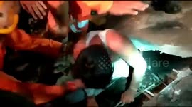 Incredible moment 17-year-old pulled out from under rubble of collapsed building in central India