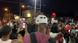 Angry Protester Addresses Crowd at Intersection